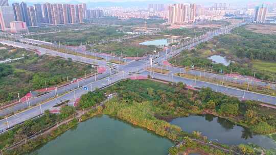 航拍惠州仲恺城市发展中的道路与建筑场景