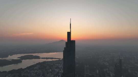 航拍江苏南京日出太阳位于紫峰大厦顶部景观