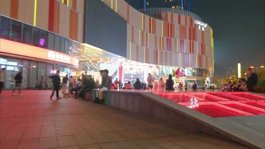 城市夜晚商场广场人流延时摄影视频素材模板下载