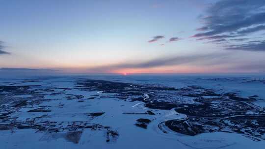 海拉尔河湿地冬天雪景日落晚霞