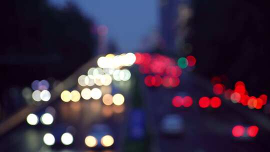 中国北京夜晚城市道路虚化光斑汽车交通景观