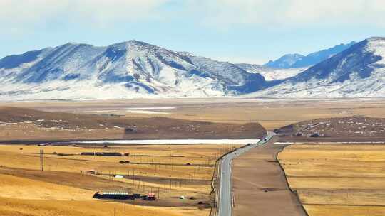 航拍冬季雪山草原公路视频素材模板下载