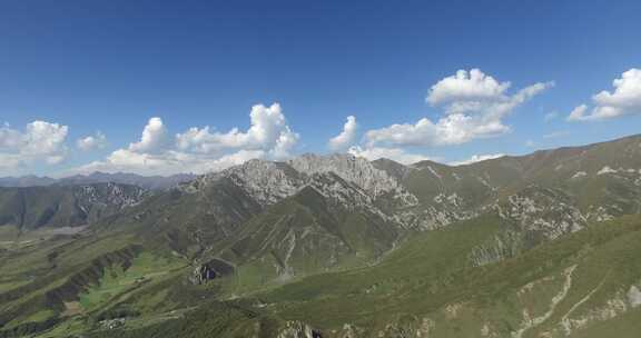 青海互助龙王树木山峰蓝天白云航拍视频