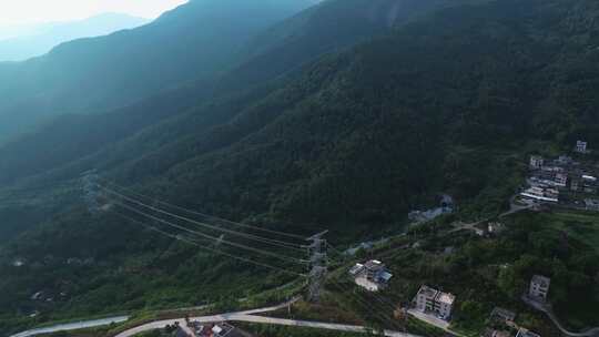 航拍群山间的变电站与高压电力铁塔输电线路视频素材模板下载