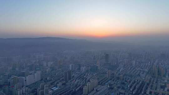 夕阳下的青海西宁城市天际线航拍