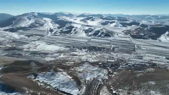 航拍承德京北第一草原蓝天积雪大山