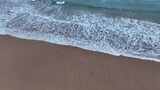 航拍东南亚泰国普吉岛海浪冲刷沙滩特写镜头高清在线视频素材下载