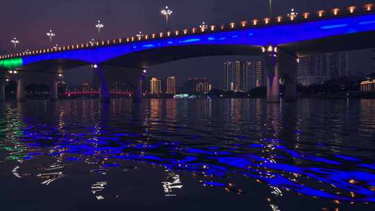 南宁邕江大桥下游船与城市滨江夜景灯光