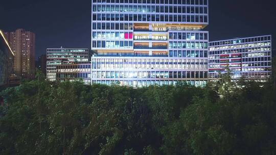航拍夜晚杭州滨江灯火通明的现代办公大楼视频素材模板下载
