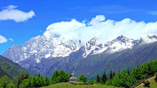 航拍四川川西夏天四姑娘山雪山蓝天白云