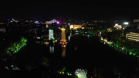 广西桂林日月双塔夜景灯光航拍视频素材模板下载