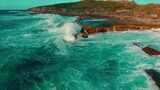 大海海浪冲击日出波浪海岛蓝天云FPV航拍高清在线视频素材下载