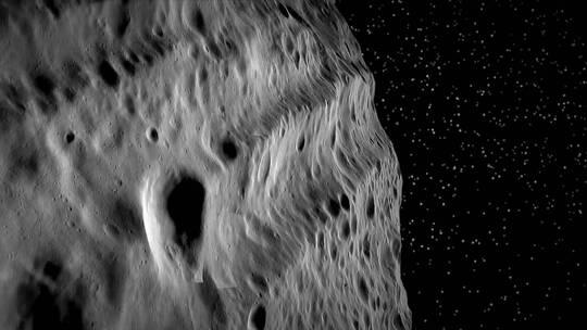 美国宇航局使用计算机图形在小行星灶神星上空飞行2018