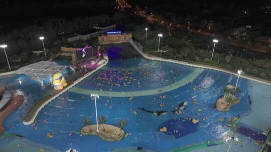 航拍上海玛雅海滩水公园游泳池夜景视频素材模板下载