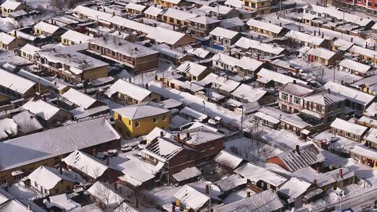 雪乡东北风景白雪覆盖下的村庄全貌航拍