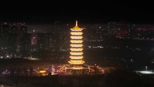 灯火辉煌的城市中闪耀的宝塔夜景