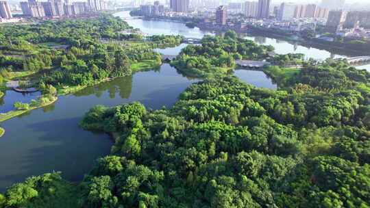 四川眉山东坡城市湿地公园城市风光日落航拍