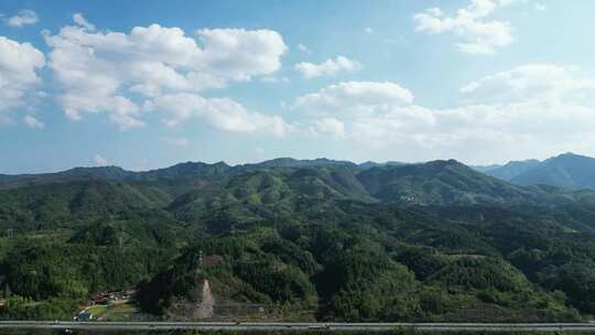 连绵起伏山川丘陵蓝天白云航拍