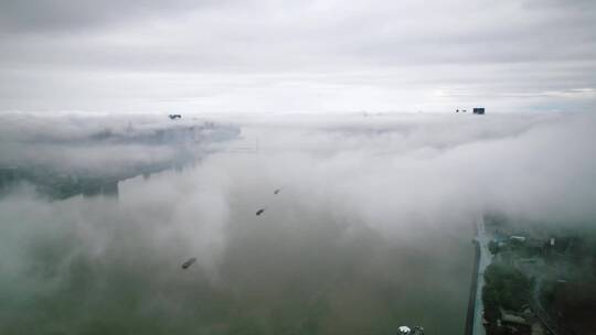 浓雾中的杭州滨江现代城市风光航拍