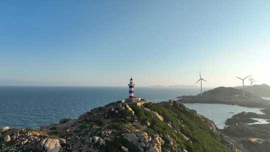 海上灯塔航拍海洋风车发电大海日出阳光海面