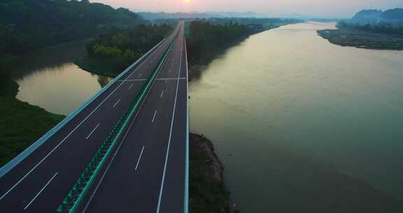航拍中国基础建设河边的高速公路夕阳美景