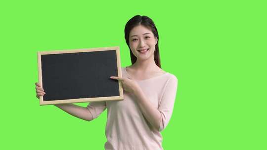 精品 · 女生手拿黑板展示动作绿幕抠像视频