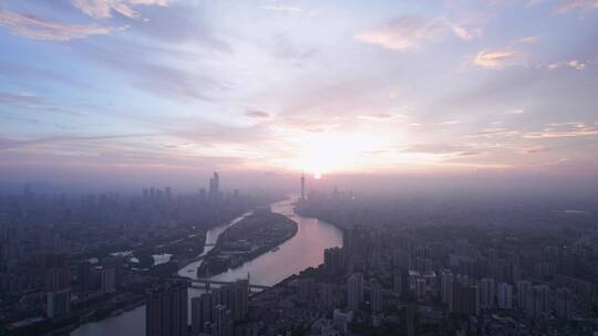广州珠江岸城市高楼建筑群与日出航拍风光