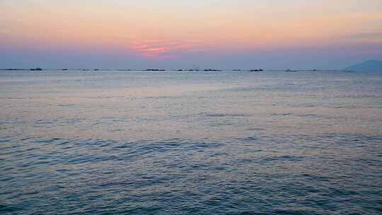 海南三亚傍晚海边夕阳晚霞椰树海浪