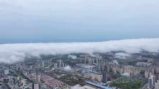 春季雨后云雾下的江西省九江城市美景航拍
