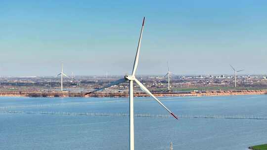 航拍湖泊风力发电机组乡村振兴环保新能源
