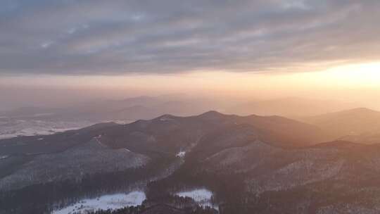 航拍寒冬山区山林雪景暮色