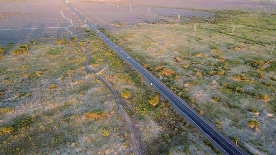 航拍行驶在笔直公路上的货车