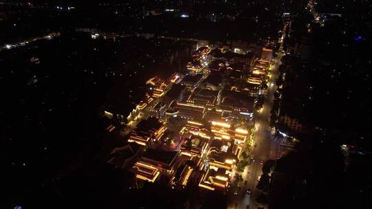 俯瞰仿古建筑商业街步行街夜景亮化前飞下降