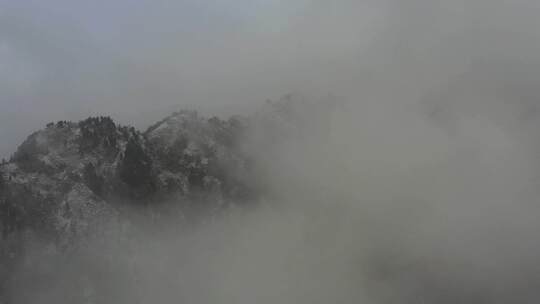 青海互助山雪景雪山山巅云雾航拍视频