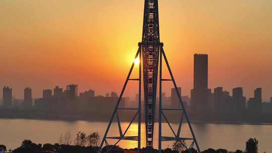 航拍日出朝阳下的摩天轮