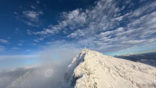 航拍雪山森林树林山脉白雪蓝天白云