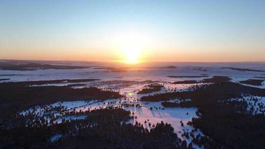 航拍雪原森林唯美夕阳