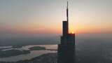 航拍江苏南京日出太阳位于紫峰大厦顶部景观高清在线视频素材下载