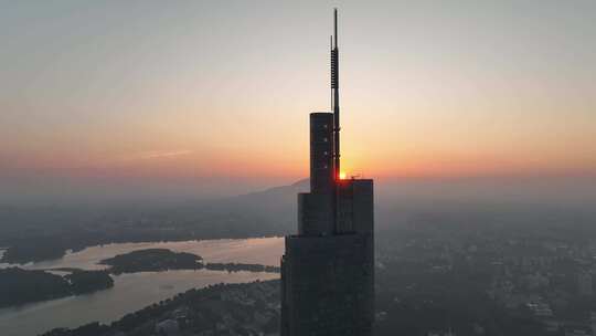 航拍江苏南京日出太阳位于紫峰大厦顶部景观