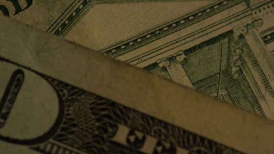 美国鹰盾背景上美国纸币的旋转镜头-MONEY 0417