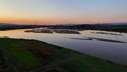 航拍宁夏石嘴山夕阳下的黄河湿地石嘴子公园