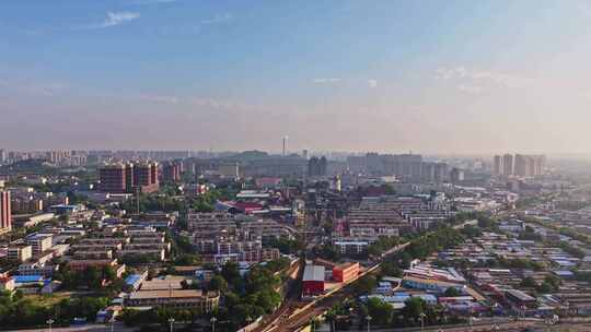 河北唐山南站城市中火车轨道与建筑鸟瞰全景