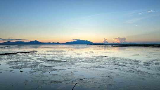 4k航拍日落晚霞后的滩涂海天一色
