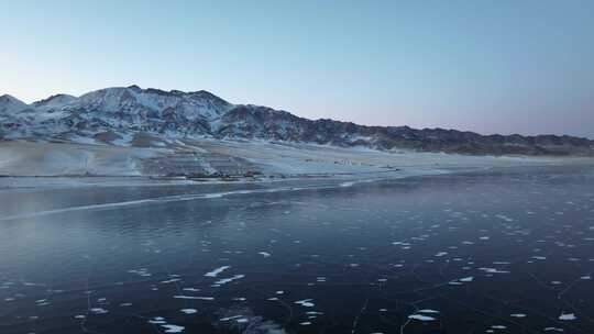 航拍冬季新疆赛里木湖雪山冰湖蓝冰