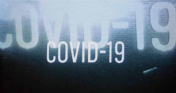 “covid-19”在破裂的屏幕上闪烁