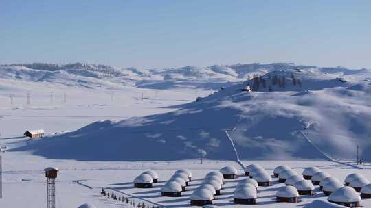 航拍新疆阿勒泰雪景吉木乃草原石城输电线路