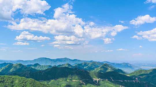 夏季蓝天白云下绿水青山群山航拍