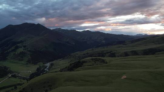 航拍格聂神山草原落日夕阳晚霞