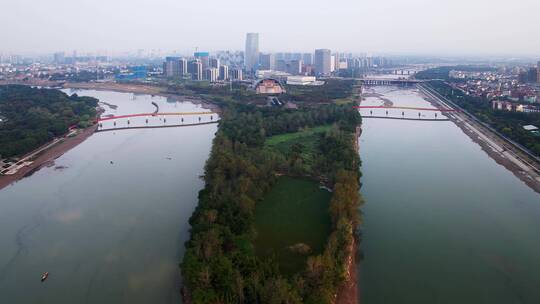 航拍夕阳金华城区江五百滩公园现代城市风光