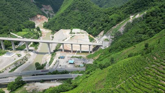 航拍大山中的高速公路高铁轨道